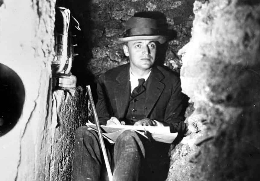 Photograph of Kenneth Conant in an excavation trench at Cluny.