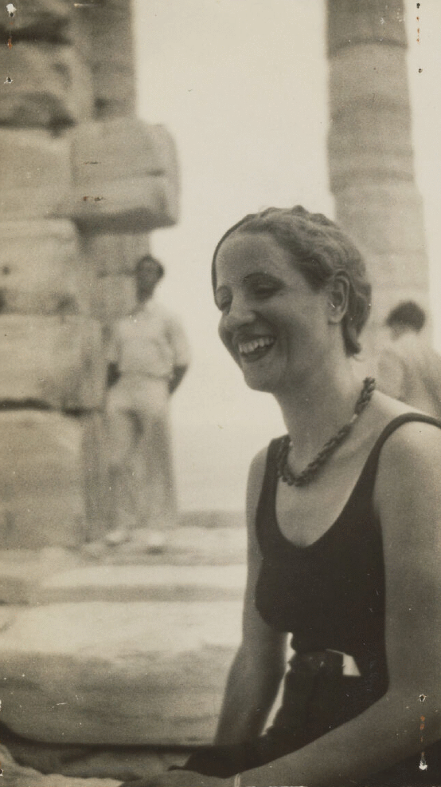 Solo portrait of female participant in a bathing suit.
