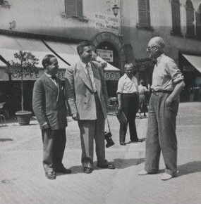 Photograph of street scene (which includes Sert and Le Corbusier).